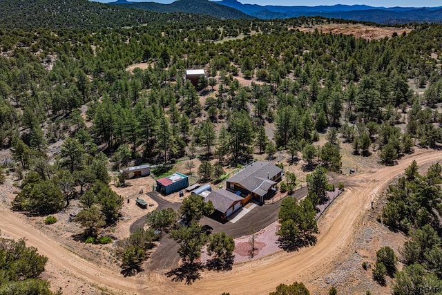 birds eye view of property with a mountain view