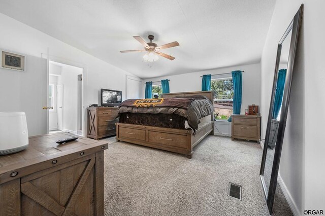 carpeted bedroom featuring ceiling fan and lofted ceiling