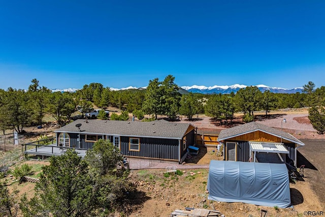 back of house with a mountain view