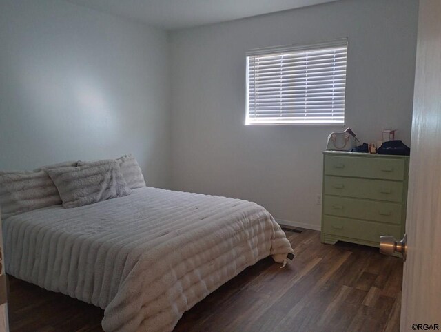 bedroom featuring dark wood-type flooring