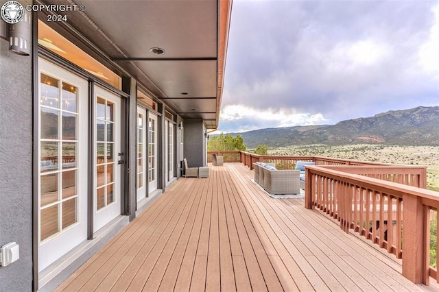 wooden terrace with a mountain view