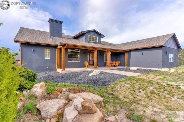 ranch-style home with a patio area