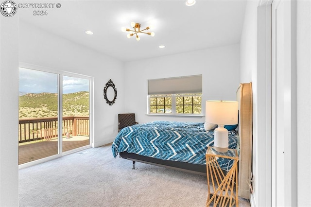 carpeted bedroom featuring access to outside