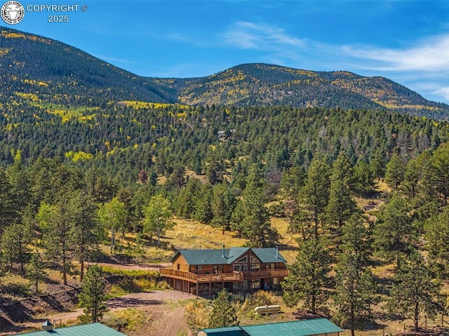 mountain view featuring a wooded view