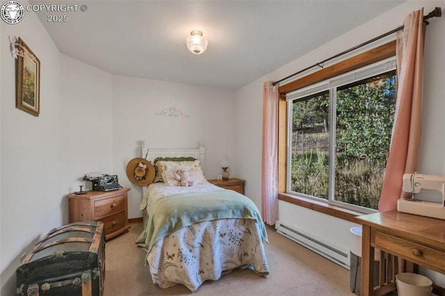 carpeted bedroom featuring a baseboard heating unit