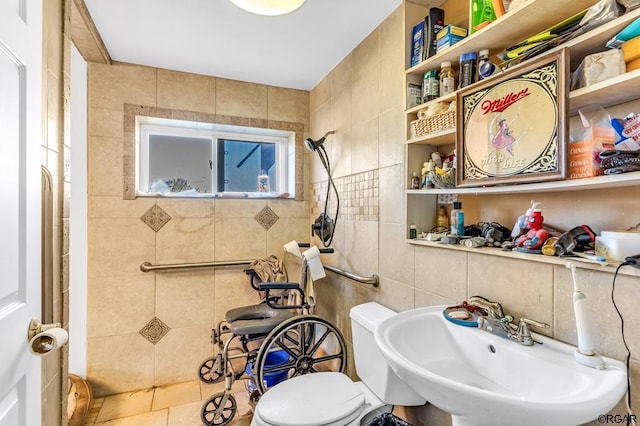 bathroom featuring tile walls, sink, tile patterned flooring, and toilet