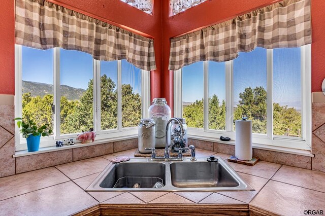 interior space with a mountain view and sink