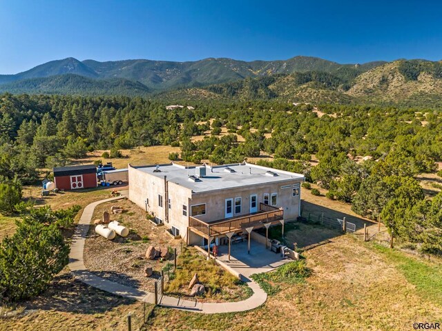 birds eye view of property with a mountain view