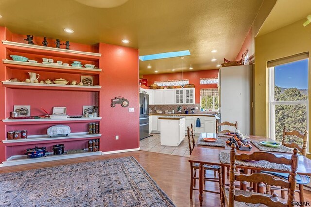 dining area with light wood-type flooring