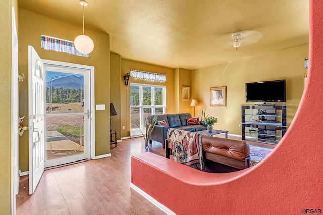 bedroom with access to exterior and hardwood / wood-style flooring