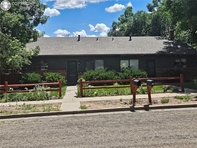 910 Allison Ave Unit A & B, Canon City, CO 81212 - view of front of house with brick siding and roof with shingles