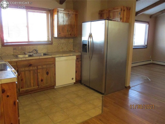 910 Allison Ave Unit A & B, Canon City, CO 81212 - kitchen featuring white dishwasher, stainless steel refrigerator with ice dispenser, tile countertops, beamed ceiling, and decorative backsplash