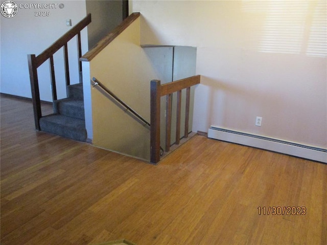 910 Allison Ave Unit A & B, Canon City, CO 81212 - staircase featuring wood finished floors and baseboard heating