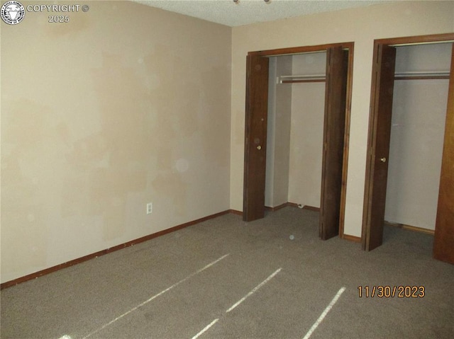 910 Allison Ave Unit A & B, Canon City, CO 81212 - unfurnished bedroom with multiple closets and carpet flooring