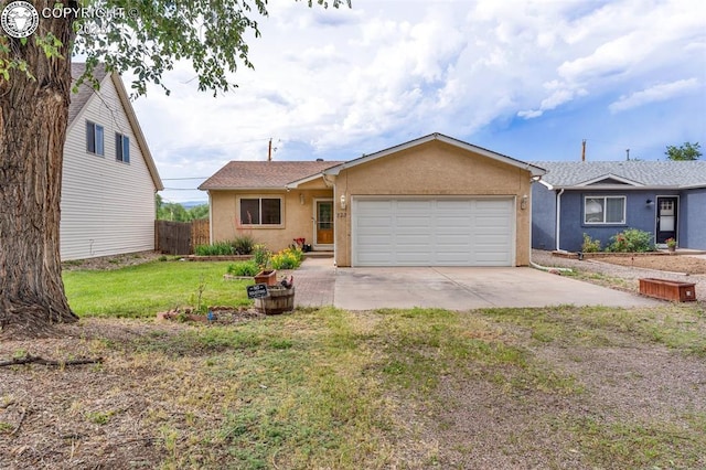 723 Griffin Ave, Canon City, CO 81212 - ranch-style house featuring concrete driveway, an attached garage, and stucco siding