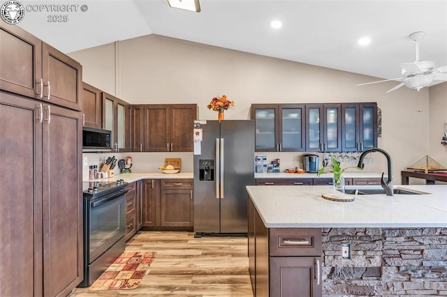 723 Griffin Ave, Canon City, CO 81212 - kitchen featuring stainless steel refrigerator with ice dispenser, electric stove, light wood-type flooring, high vaulted ceiling, and glass insert cabinets