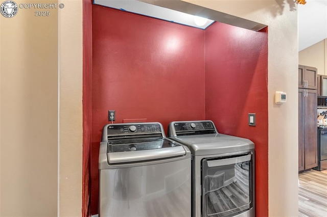 723 Griffin Ave, Canon City, CO 81212 - laundry room featuring washer and clothes dryer and wood finished floors