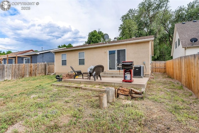 723 Griffin Ave, Canon City, CO 81212 - back of house with a patio area, stucco siding, and a fenced backyard