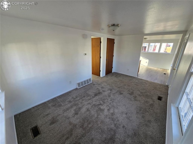 spare room featuring carpet