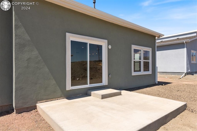 rear view of house featuring a patio area