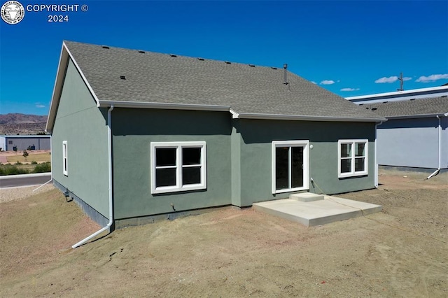 rear view of house featuring a patio area