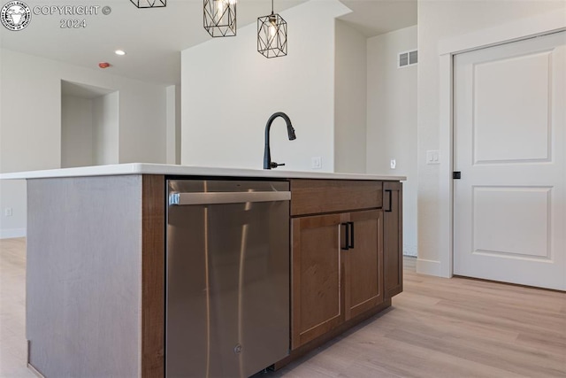 bar with dishwasher, sink, pendant lighting, and light hardwood / wood-style floors