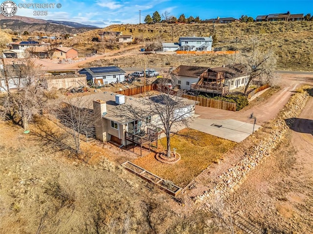 birds eye view of property featuring a mountain view