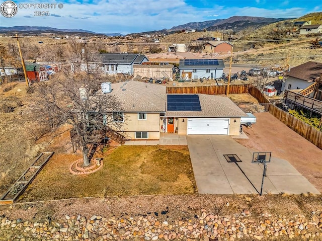 drone / aerial view featuring a mountain view