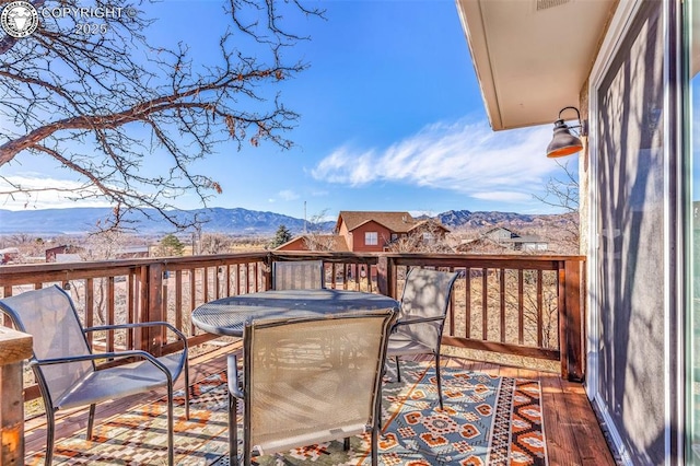 wooden terrace with a mountain view