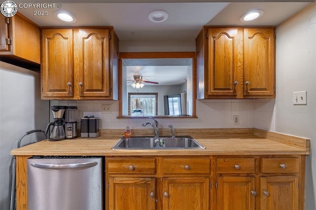 kitchen with tasteful backsplash, sink, dishwasher, and ceiling fan