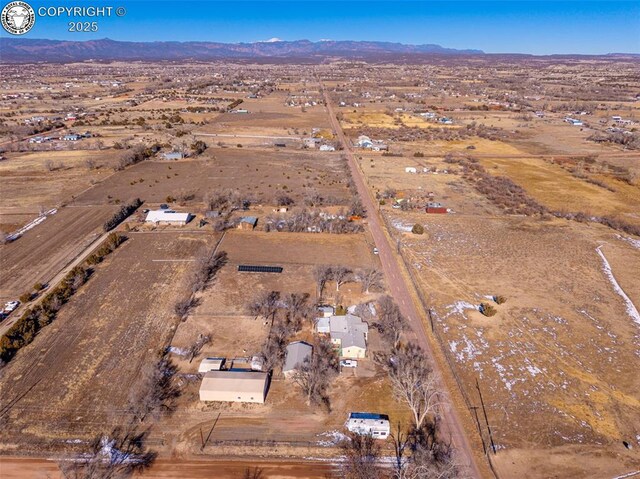 bird's eye view with a mountain view and a rural view