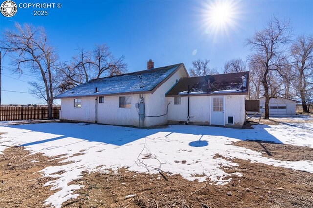 view of snow covered property