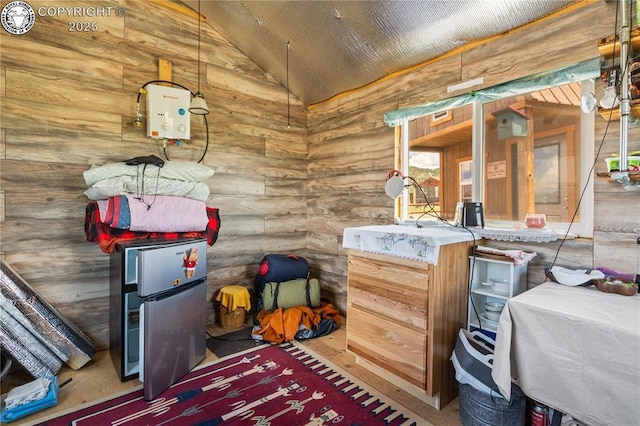 interior space featuring lofted ceiling and log walls