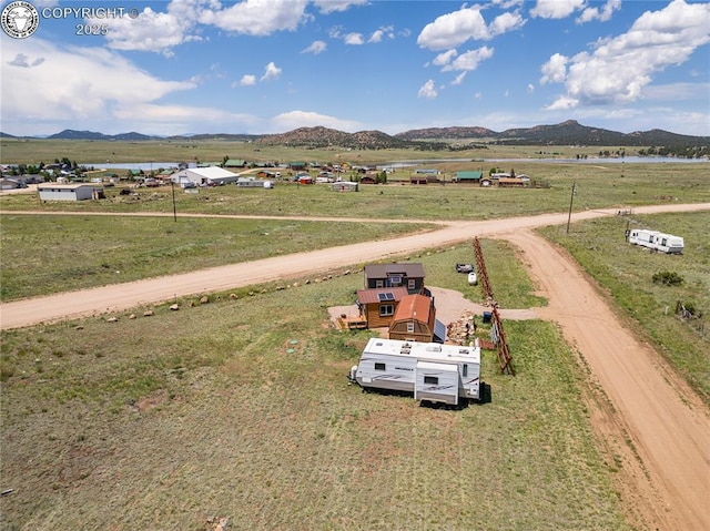 aerial view featuring a rural view and a mountain view