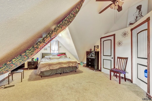 bedroom featuring lofted ceiling, ceiling fan, and carpet