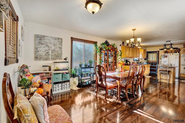 dining area featuring a notable chandelier