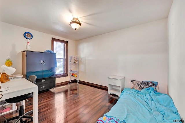 bedroom featuring dark hardwood / wood-style floors