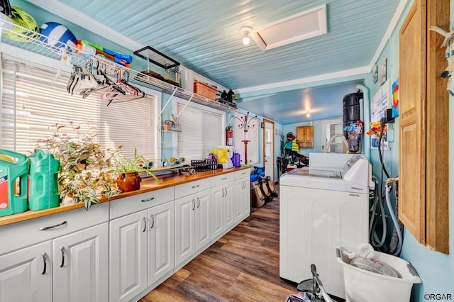 washroom featuring wood-type flooring and washing machine and dryer