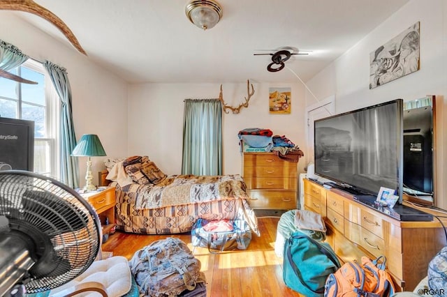 bedroom with hardwood / wood-style flooring