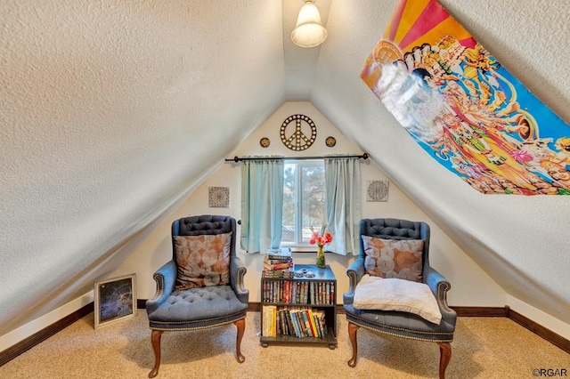 living area with lofted ceiling, carpet floors, and a textured ceiling