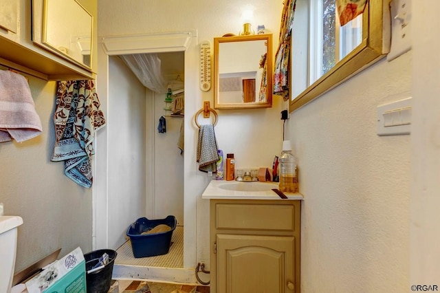 bathroom with vanity and toilet