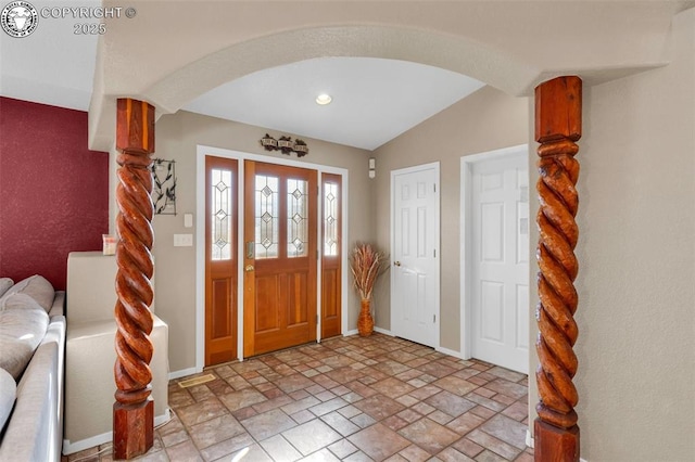 foyer featuring vaulted ceiling