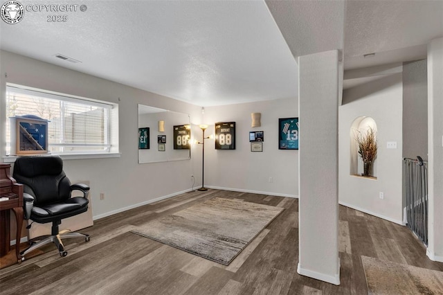 entryway featuring dark hardwood / wood-style floors and a textured ceiling