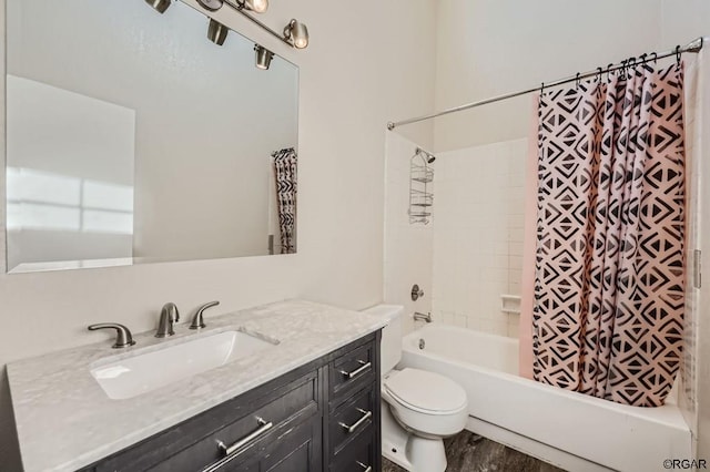 full bathroom featuring hardwood / wood-style flooring, toilet, vanity, and shower / bath combo with shower curtain