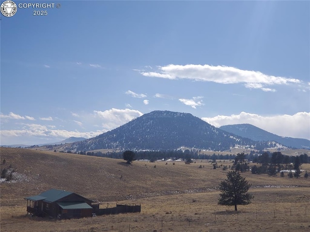 mountain view featuring a rural view