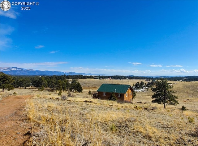 mountain view featuring a rural view