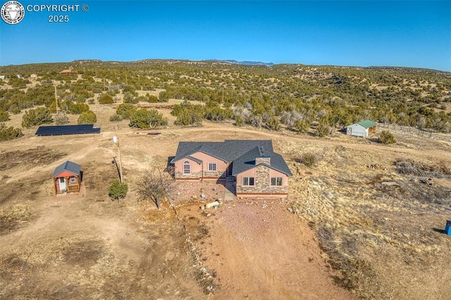 birds eye view of property featuring a mountain view