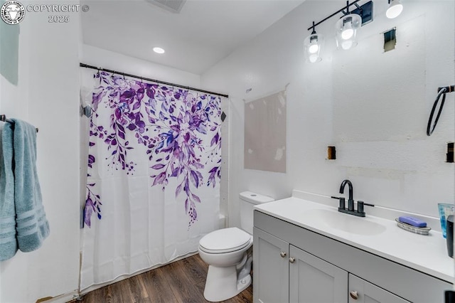 full bathroom featuring shower / bathtub combination with curtain, wood-type flooring, toilet, and vanity