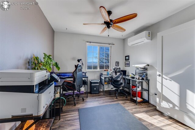 office space featuring ceiling fan, an AC wall unit, and dark hardwood / wood-style flooring