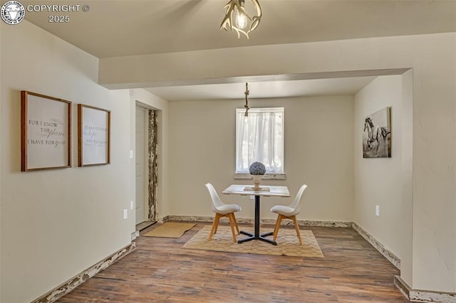 dining room with wood finished floors and baseboards